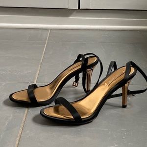 BCGBMaxAzria 3.5 inch gold and black strappy heels